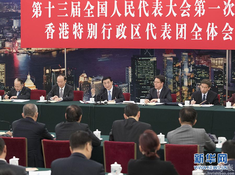 王沪宁分别参加全国两会香港代表团、澳门代表团讨论和审议